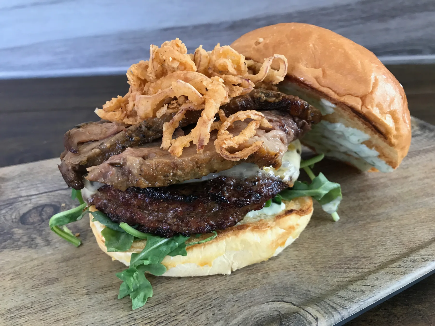 Red Maple brisket burger on a brioche bun