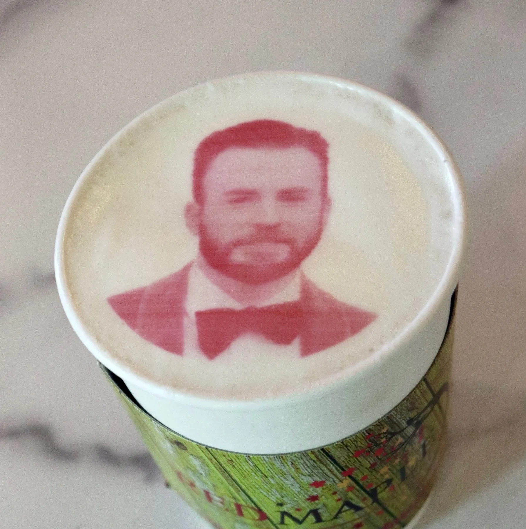 To-go latte with printed image on top
