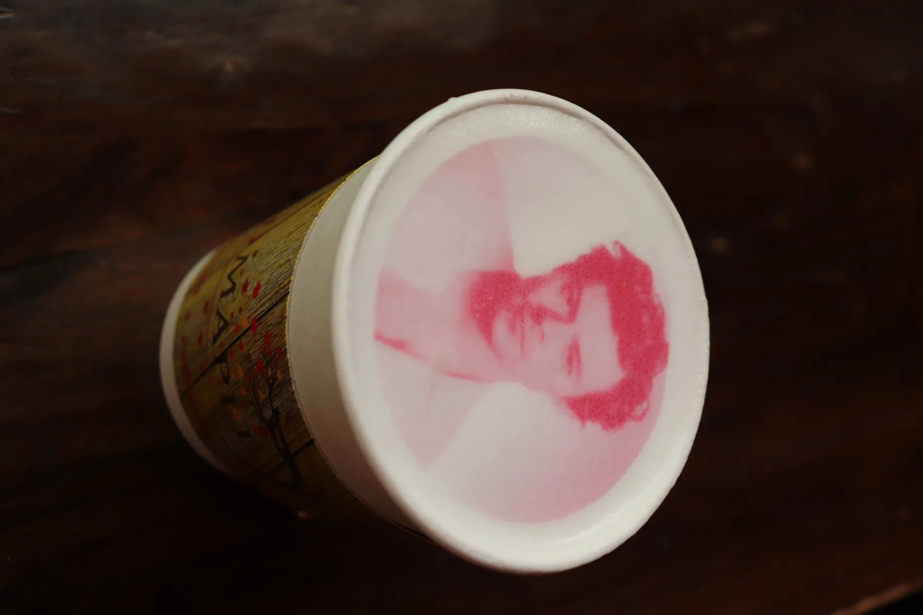 Barista-printed latte in a to-go cup