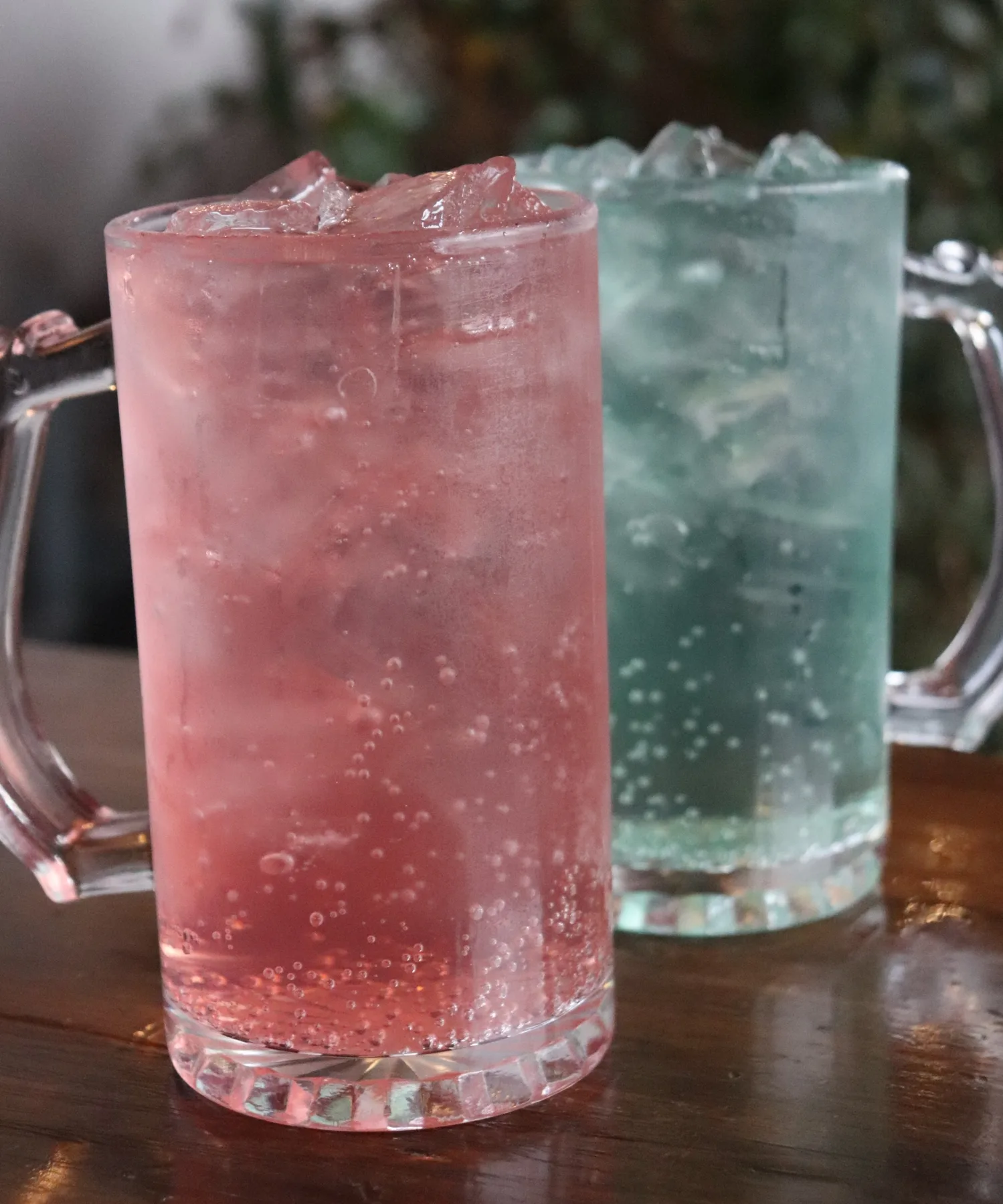 A row of brightly colored flavored lemonades