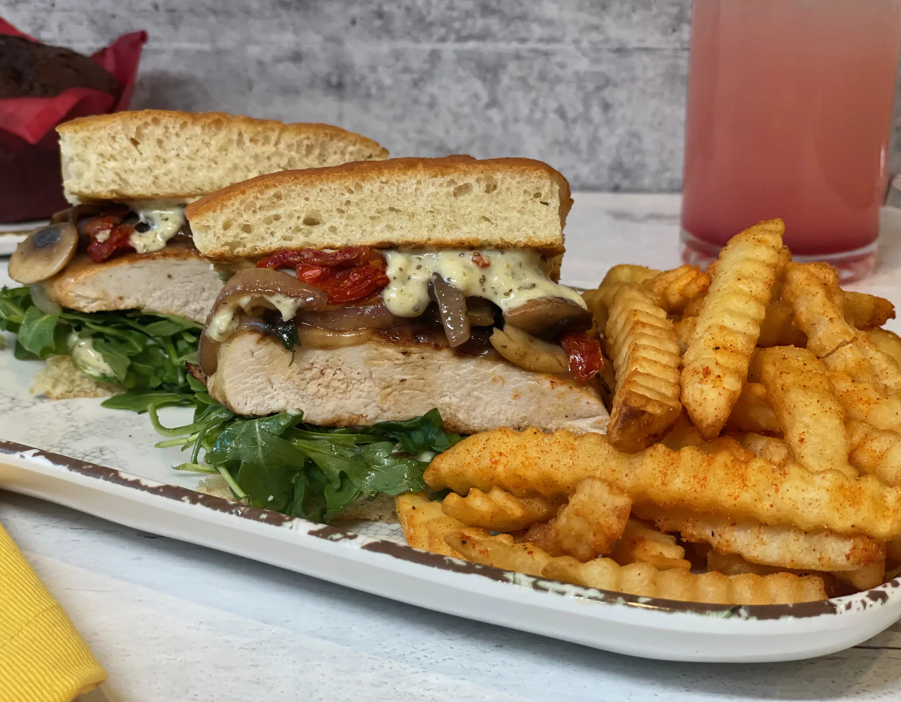 Sandwich plated with seasoned fries