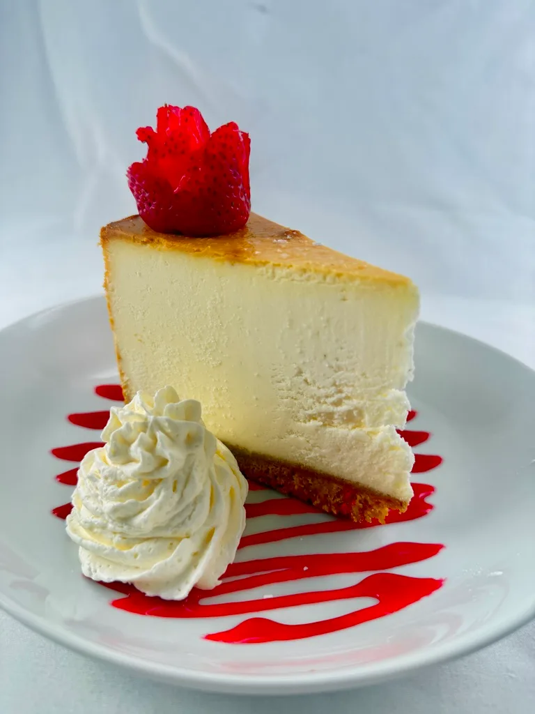 Rich & creamy with a strawberry coulis and whipped cream