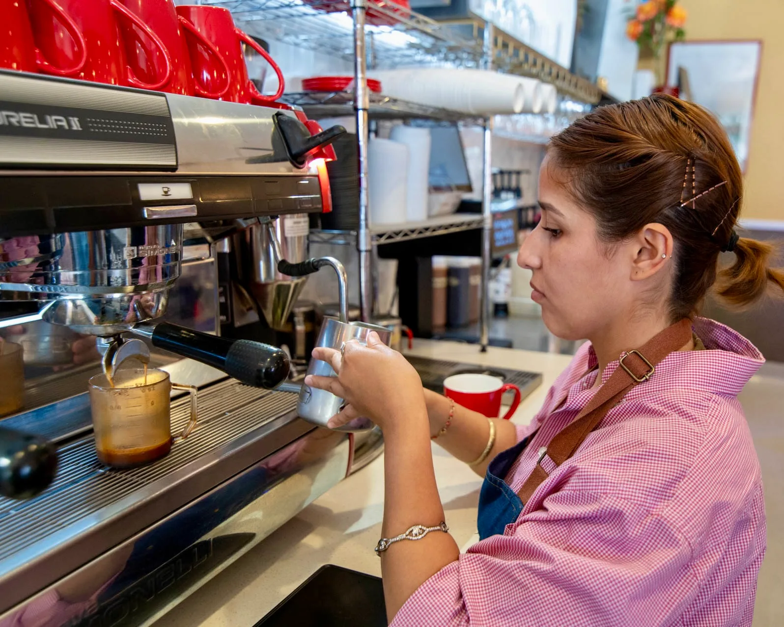 Barista Preparing A Latte